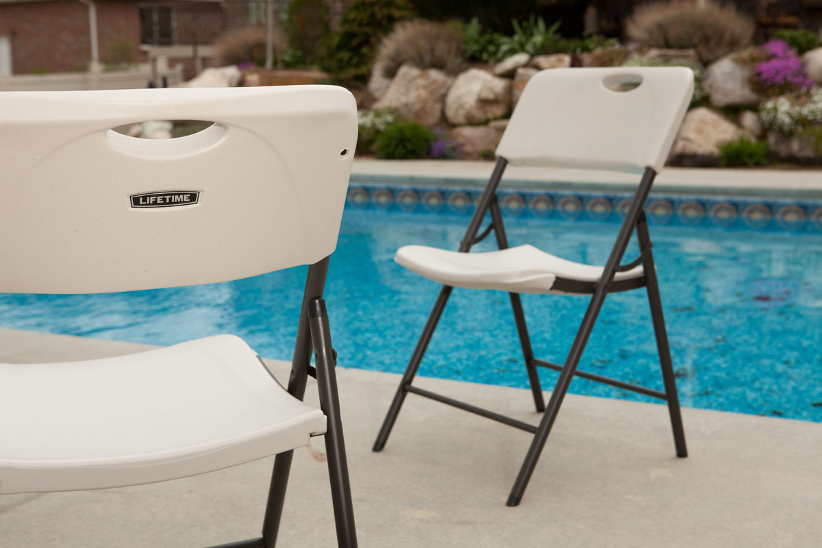 White plastic folding chairs — our basic chair rental